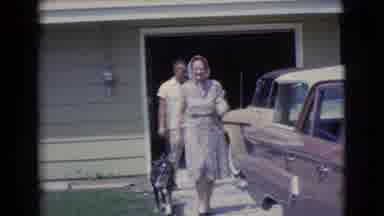 Clarkdale Arizona (1961): Woman Followed By Dog Waves Then Walks Past Brown Car