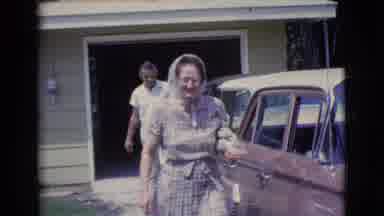 Clarkdale Arizona (1961): Woman Walks Away From Man Towards Camera
