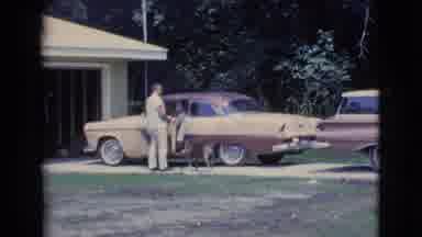 Clarkdale Arizona (1961): Brown Car Parked While A Driver Talks To A Man