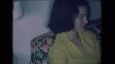 Salton Sea California (1961): Lady Sitting In Yellow Dress On Floral Couch With