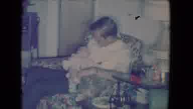 Salton Sea California (1961): Man Sitting In A Comfy Chair Holding A Adorable