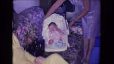 Salton Sea California (1961): A Woman Is Placing A Sleeping Baby In A Basket On