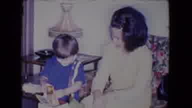 Salton Sea California (1961): Boy Wearing Blue Shirt Plays With White Box While