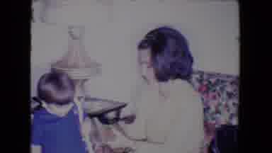 Salton Sea California (1961): Family Unwrapping Gifts As Baby Sleeps On The Sofa