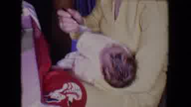 Salton Sea California (1961): Lady In A Yellow Suit With A Baby On Her Lap Feeding