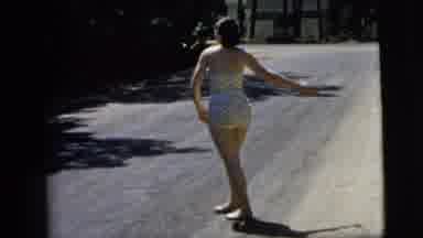 Camden New Jersey (1962): Woman Standing On A Gravel Road In Bathing Suit Throws