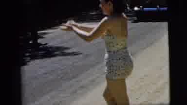 Camden New Jersey (1962): Lady Throws Object In Her New Swimsuit On The Road In