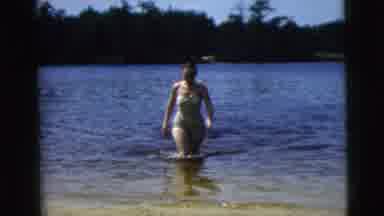 Camden New Jersey (1962): Woman In A Swimsuit Walking Out Of A Lake On A Sunny Day