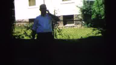 Camden New Jersey (1962): A Gentleman Outside The House Two People Having Fun