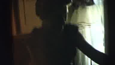 Camden New Jersey (1962): Mum Putting Reluctant Youngster In Chair While Family