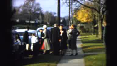Camden New Jersey (1962): People In Formal Clothes Standing Around On A Sidewalk