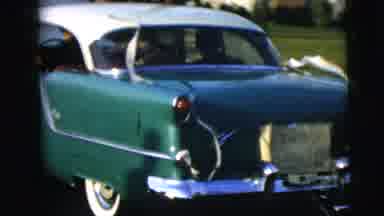 Camden New Jersey (1962): Classic Green And White Car Drives Off Down Road With