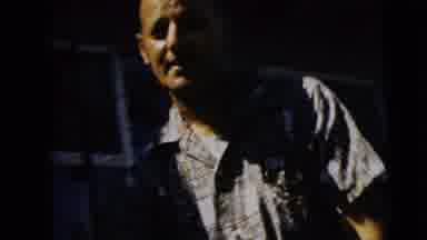 Camden New Jersey (1962): Man Wearing White Shirt Holds Rifle On A Clear Sunny Day