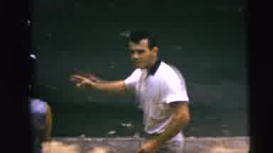 Camden New Jersey (1962): Man Smoking And Interacting With Women As They Head