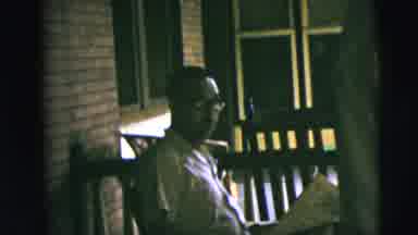 Camden New Jersey (1962): Man Reading Newspaper In A Rocking Chair And Then