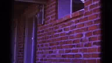 Cottonwood Arizona (1964): Short Video Of Brick Building With Open Window And Two