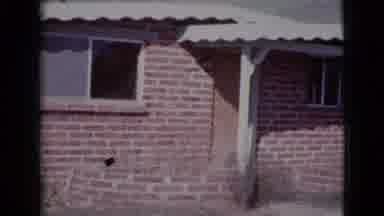 Cottonwood Arizona (1964): A Home With A Brick Facade And An Awning Two Brick
