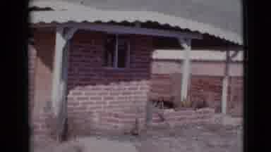 Cottonwood Arizona (1964): Camera Pans Over A Home With A Brick Facade An Awning