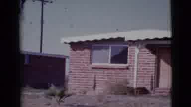 Cottonwood Arizona (1964): Brick House With Metal Roof With Boarded Up Entry With