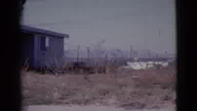 Cottonwood Arizona (1964): An Old House With A Porch Sits In An Overgrown Yard