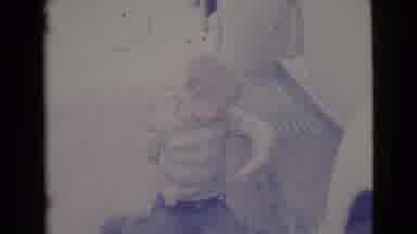 Cottonwood Arizona (1964): A Small Boy Is Sitting On The Ground And Sweeping Dust