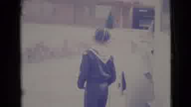 Cottonwood Arizona (1964): Cub Scout Hugs Woman Wearing Glasses On A Bright Sunny