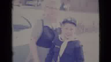 Cottonwood Arizona (1964): Male Child In Boy Scout Uniform Pushing Red Bicycle On