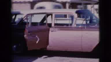 Cottonwood Arizona (1964): Man Looking Into The Back Of Station Wagon Hitched To