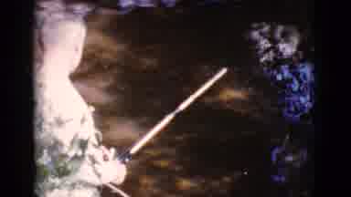 Cottonwood Arizona (1964): A White Male Stops Fishing In Dirty Brown Water And