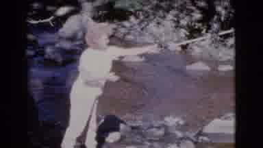 Cottonwood Arizona (1964): A Caucasian Woman Casts Her Fishing Pole And Fishes In
