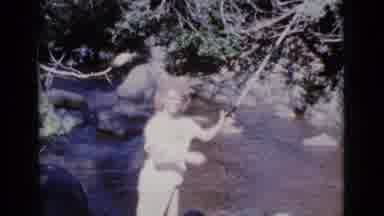 Cottonwood Arizona (1964): A Woman In White Dress Is Fishing In A River With
