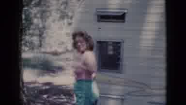 Cottonwood Arizona (1964): Lady In Shorts And Halter Top Walking Outside A Camper