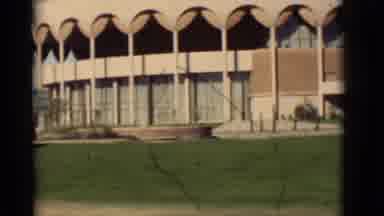 New Mexico-1964: Driving Down The Road Looking At A Big Round Building Like A
