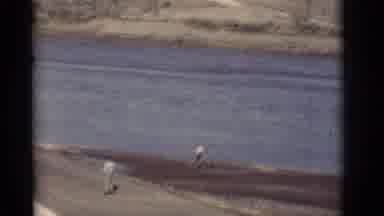 New Mexico (1964): A Large River Runs Next To A Road And There Are Some Desert