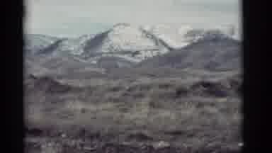 New Mexico (1964): Snow-Capped Mountain Peaks Are Glistening Brightly In The