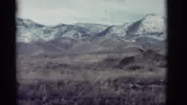 New Mexico (1964): Amazing Snow Covered Mountains Behind Beautiful Green Rolling