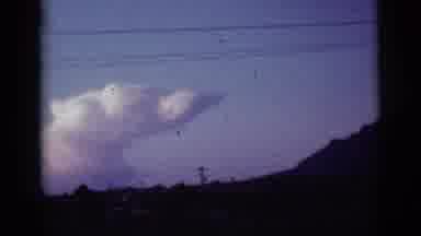 Tuscon Arizona (1965): A Distant Rainbow And Large Clouds Behind Power Lines And