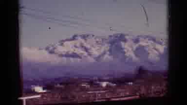 Tuscon Arizona (1965): Brown Field With Distant Snowy Mountain Range Covered