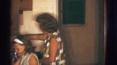 Clarkdale Arizona (1966): A Woman And Her Daughter In A Kitchen The Woman Waves At