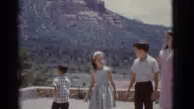 Clarkdale Arizona (1966): A Family Is Walking In The Courtyard On A Sunny Day