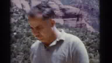 Clarkdale Arizona (1966): Boy Wearing Blue Shorts Rubs Nose On A Bright Sunny Day