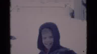 Clarkdale Arizona-1966: Boy Wearing Blue Coat Shovels Snow With Dog On Winter Day