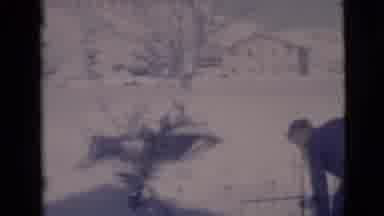 Clarkdale Arizona (1966): A Man Is Dressed Warmly In Black As He Shovels Snow