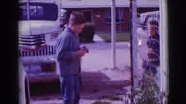 Clarksdale Arizona (1968): Two Young Boys Outside By Vehicles Looking For