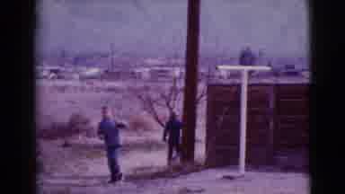 Clarksdale Arizona-1968: Boy Walking Through Dry Field Near Distant Homes