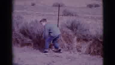 Clarksdale Arizona (1968): Boy Removes Stone From Small Clump In Front Of Him In