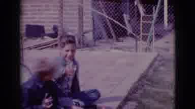 Clarksdale Arizona (1968): Two Boys Are Sitting Outside On A Patio When A Man