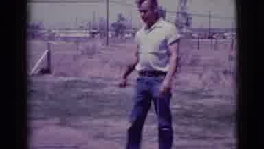 Clarksdale Arizona (1968): Man Is Standing Around Wearing Blue Jeans And A Kid