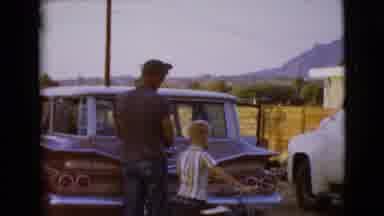 Clarksdale Arizona (1968): Man By Car And Then Child Comes Over With Bike