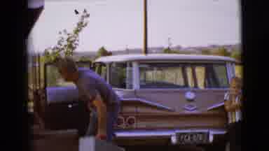 Clarksdale Arizona (1968): A Man Taking A Suitcase Out Of His Car